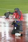Rain falls on photographer and organisers at the Commonwealth Games, Glasgow. Photo: David T. Hewitson/Sports for All Pics